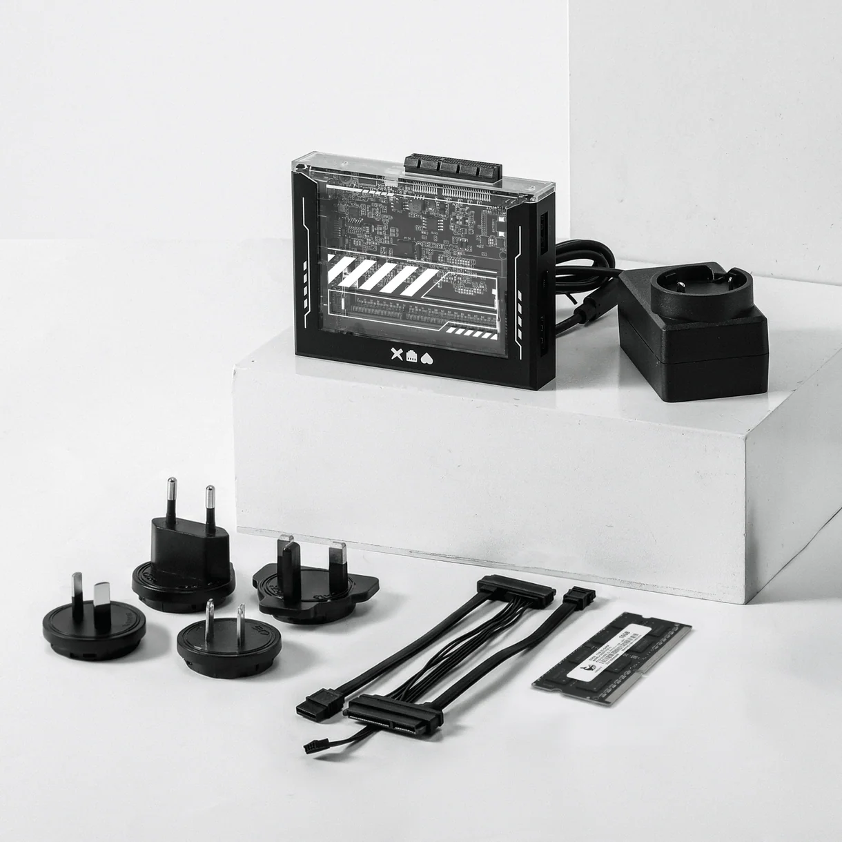 ZimaBoard SE kit with power adapter, interchangeable plug adapters, SATA-Y cable and RAM module
